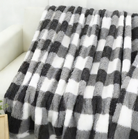 Plaid en polaire tricoté personnalisé OEM ODM, quatre saisons, 100% polyester, doux, noir et blanc à carreaux, décoratif
