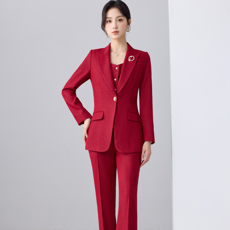 Red suit flared trousers brooch