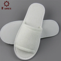 OEM Vente en gros Logo personnalisé Pantoufles jetables blanches bon marché pour Spa Pantoufles d'hôtel Semelle EVA en coton et velours