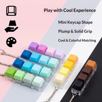 Jouet anti-stress en plastique, couleur unie, macaron, clavier linéaire à quatre touches, porte-clés carré, petit pendentif