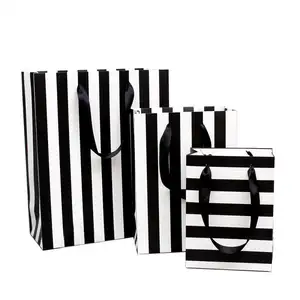 Christmas gift packaging eco custom logo printed shopping handle black white stripe Art Cardboard Paper Bags for gift clothes