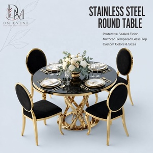Table de réception ronde personnalisée en acier inoxydable doré avec base torsadée en croix et plateau en verre trempé miroir - Product Image 1