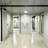 Maison conteneur extensible JJM 20 pieds, 2 chambres, modulaire préfabriquée avec système d'énergie solaire, utilisation hôtelière, design moderne, garantie 5 ans