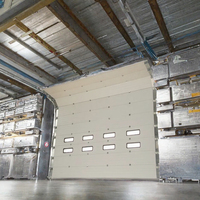 Porte sectionnelle industrielle isolée, coupe-vent, à ouverture latérale électrique pour entrepôt et atelier