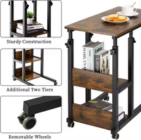 Table basse réglable en hauteur avec roues et support de rangement, adaptée aux chambres et aux salons