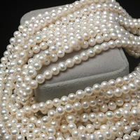 Vente en gros de perles d'eau douce naturelles blanches de qualité AAA+ de 6 mm, presque rondes, avec trou percé pour la fabrication de bijoux