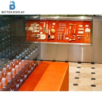Vitrine de présentation de parfums de luxe, étagère de présentation de cosmétiques à LED, présentoir de vente au détail personnalisé pour les produits de maquillage et de soin de la peau