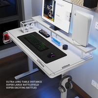 Vente en gros Bureau ergonomique électrique réglable en hauteur pour ordinateur de jeu blanc avec étagère de rangement