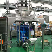 Équipement d'emballage vertical entièrement automatique à plusieurs têtes de pesage pour l'emballage de noix, bonbons, chocolat, haricots et snacks