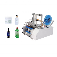 Vente à chaud imprimante de code de date manuelle semi-automatique machine d'étiquetage de bouteilles rondes d'eau en verre plastique PET autocollant