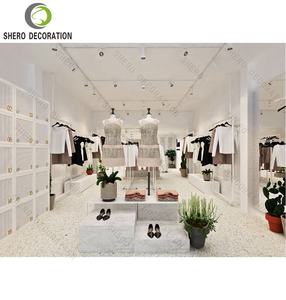 Diseño Interior de Salón de Exposiciones Personalizado de Fábrica, Muebles para Tienda de Ropa Femenina con Vitrinas y Estantes para Exhibición de Prendas - Product Image 1