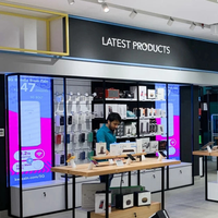 Comptoir de magasin de téléphonie mobile en verre moderne avec design personnalisé, matériau durable pour les magasins de vente au détail de téléphonie mobile