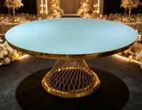 Table de banquet ronde de luxe en cristal avec base en grille dorée pour la location d'événements hôteliers
