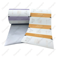 Rollo de película de embalaje automático Flexible laminado de papel de grado alimenticio arcoíris con impresión de gradiente personalizada de fábrica