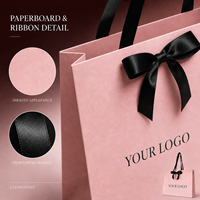 Sacs cadeaux en papier cosmétique de luxe en carton rose avec poignées en ruban noir pour l'emballage de coffrets cadeaux de beauté en gros
