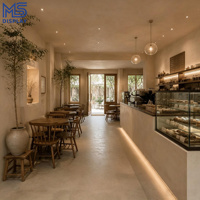 Comptoir de café personnalisé de style Wabi Sabi avec vitrine à pâtisserie pour projet d'aménagement intérieur de café-boulangerie