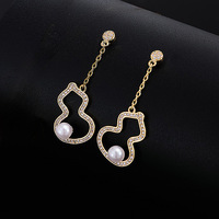 Vente en gros de boucles d'oreilles haut de gamme collier ensemble de bagues colliers de perles de gourde creuse bagues plaquées or incrustées de zircon ensemble de bijoux pour femmes