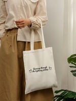 Sac fourre-tout en toile avec motif cœur éclair et citation positive, sac à bandoulière réutilisable avec slogan inspirant, sac à main quotidien pour femme