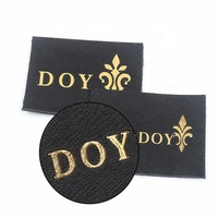 Étiquettes personnalisées pour veste en cuir véritable noir avec logo de marque imprimé en feuille métallisée
