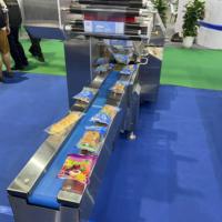 Petite machine d'emballage automatique de type coussin pour bonbons gélifiés, bonbons glacés, bonbons en bâtonnets, pain et savon