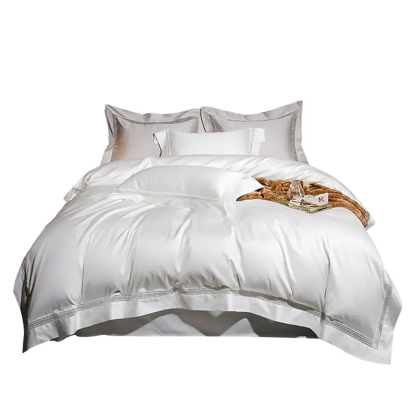 豪華な100% エジプト綿の白い寝具セットダブルベッド5つ星ホテルのベッドリネン用の中空ボーダーデザイン