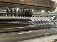 Machine de perforation et de découpe à chaud pour film plastique en rouleau avec aiguilles