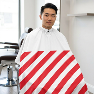 Capes de barbier professionnelles confortables et ajustables en polyester durable, imperméables, avec finition soyeuse - Product Image 1