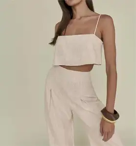 Kadın yaz beyaz keten iki parçalı Set moda kolsuz Tank Top yeni eşleşen yüksek bel geniş pantolon seti