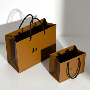 Bolsa <span class=keywords><strong>de</strong></span> <span class=keywords><strong>papel</strong></span> <span class=keywords><strong>Kraft</strong></span> marrón personalizada con asas impresas con el logotipo <span class=keywords><strong>de</strong></span> su marca para compras al por menor <span class=keywords><strong>de</strong></span> alimentos para boutiques y escaparates - Product Image 3