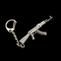 Fabricant en gros de mini porte-clés en métal en forme de pistolet, porte-clés en métal personnalisé en forme de pistolet