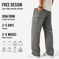 Jean en denim pour homme coupe slim, style streetwear, avec lettrage jacquard intégral, ourlet incurvé et jambe évasée, collection Printemps/Automne
