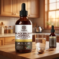 Complément alimentaire liquide GMP OEM sous marque privée : Gouttes de noix noires, armoise, clou de girofle et ail pour la santé digestive et l'équilibre intestinal