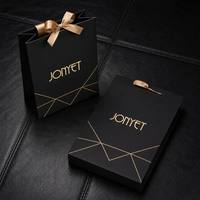 Sacs cadeaux en papier personnalisés de haute qualité avec logo sur mesure et poignée en ruban pour l'emballage des produits de soin de la peau, service d'usine de production tout-en-un