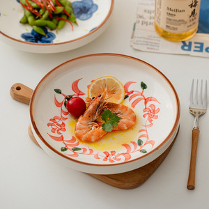 Plato de servir redondo de cerámica pintado a mano con diseño floral bajo esmalte para uso doméstico - Product Image 1