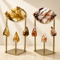 Vente en gros de nouveaux modèles d'œil d'Horus en cristal naturel sculpté, artisanat en cristal avec support métallique pour la décoration et les cadeaux