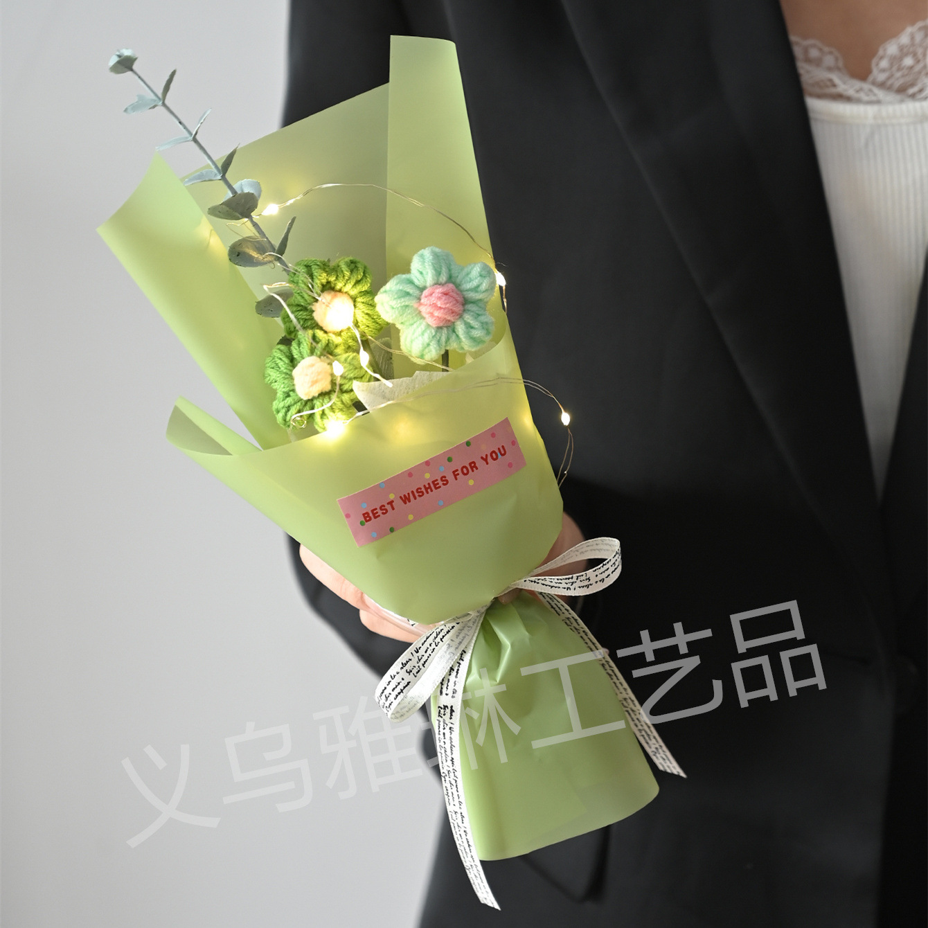 Three green flowers on green paper