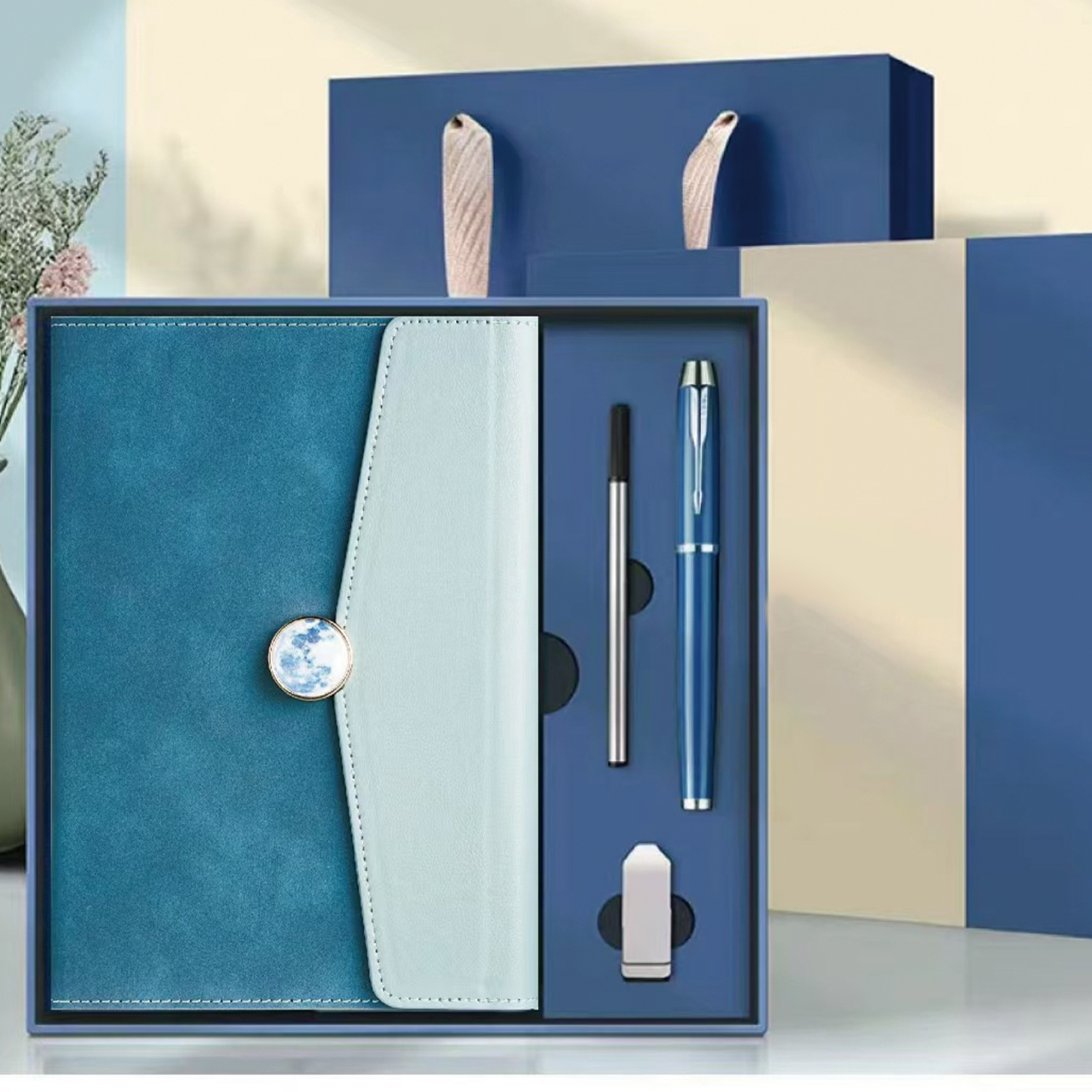 Notebook + Pen + Pen refill + USB drive