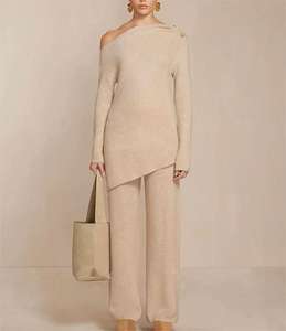 Fabricantes de prendas de punto personalizado abierto fuera del hombro de las mujeres a juego acanalado de punto superior de dos piezas suéter pantalones conjunto de las mujeres - Product Image 1