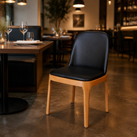 Chaise de salle à manger moderne en bois de hêtre avec dossier et assise rembourrés noirs pour café commercial, bistrot, hôtel, restaurant