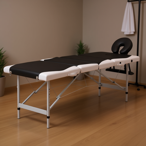 Cama de masaje plegable de aluminio en blanco y negro con 4 zonas y diseño cómodo para masaje corporal. - Product Image 2