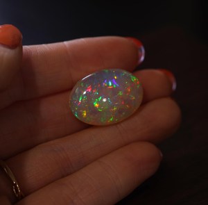 Magnifique pierre précieuse d'opale naturelle éthiopienne Personnalisable Octobre Birthstone Colorful Loose Oval 24x17mm Gemstone - Product Image 1