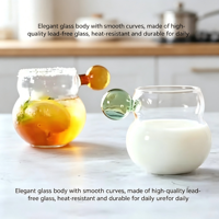 Bouteille en verre monocouche de luxe de haute qualité avec design minimaliste, poignée sphérique en forme de gourde, surface transparente estampillée or