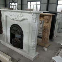 Cheminée en marbre blanc sculpté avec insert en fonte, style classique européen, cadre de cheminée en pierre polie