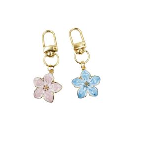 New Cross-border <b>Hot</b> Sale Korean Style Simple Cute Girl Pear Flower Zinc Alloy Pendant Keychain <b>Bag</b> Small Gift Model 000 - Product Image 5