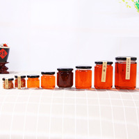 Khusus Kosong Selai Kacang Berbentuk Batu Api Kaca Mewah Toples Saus Makanan Acar Bumbu Jam Kaca Madu Jar dengan Tutup Hitam