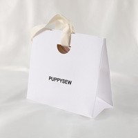 Bijoux en papier blanc de luxe personnalisé sacs fourre-tout avec poignée de ruban et logo imprimé cosmétiques anneau collier shopping sac à main