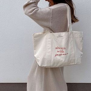 กระเป๋าผ้าแคนวาสแบบขายส่ง ใช้ซ้ำได้ มีช่องซิป ปิดผนึกได้ พิมพ์โลโก้ตามสั่ง กระเป๋าช้อปปิ้งแฟชั่นสำหรับผู้หญิง - Product Image 2