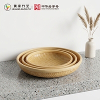 Panier de rangement rond en bambou tressé chinois moderne avec design portable et durable pour fruits, aliments et collations