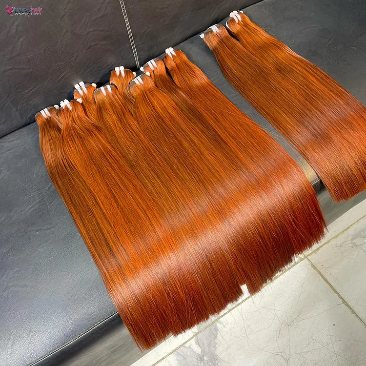 Venta al por mayor barato cabello humano sin procesar de un solo donante pelo crudo, color jengibre pelo doble dibujado vietnamita, paquetes de pelo crudo birmano