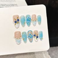 Ongles en acrylique à presser, texture vague 3D bleu glace myrtille, décor perles dorées, forme amande, longueur moyenne, logo personnalisable